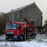 Contract Services truck with church in the background Drain Cleaning Contract Services in Northern Ireland