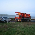 Red small truck parked at the shore Drain Cleaning Contract Services in Northern Ireland